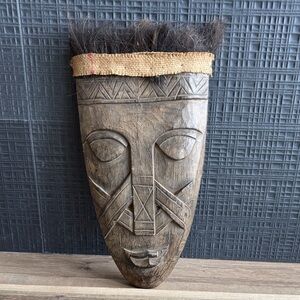 Handcrafted Wooden Tribal Mask with Dark Accents